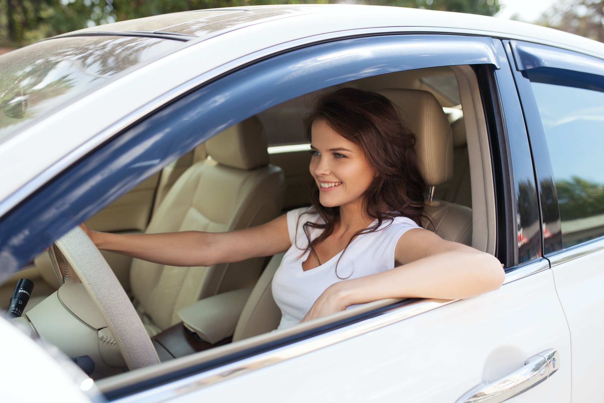 Young Happy Smiling Woman Driving Car